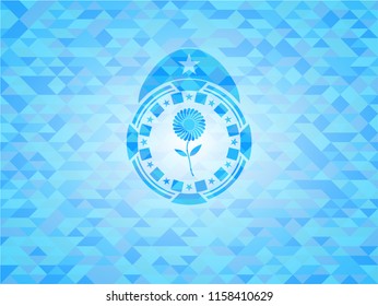 flower icon inside sky blue mosaic emblem