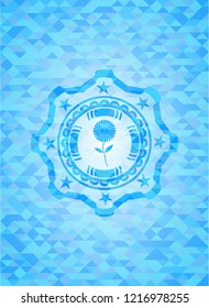 flower icon inside sky blue mosaic emblem
