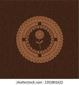 flower icon inside wood emblem