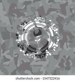 flower icon on grey camouflaged texture