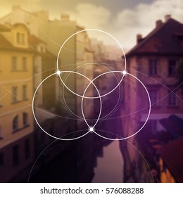 Flower of life - the interlocking circles ancient symbol in front of blurred photorealistic natural background. Sacred geometry - mathematics, nature, and spirituality, the formula of nature.