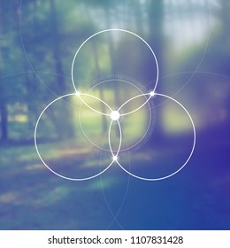 Flower of life interlocking circles hipster sacred geometry illustration with golden ratio digits and light dots in front of photographic background.