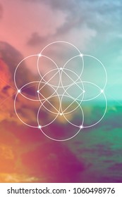 Flower of life interlocking circles and triangles sacred geometry illustration with golden ratio digits in front of photographic background.