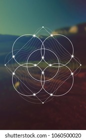 Flower of life interlocking circles and triangles sacred geometry illustration with golden ratio digits in front of photographic background.