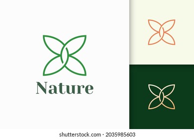 Flower logo in feminine and luxury style for health and beauty