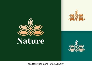 Flower logo in feminine and luxury style for health and beauty