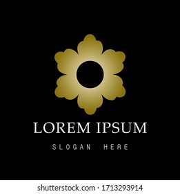 Flower logo. Geometric gold flower with black background