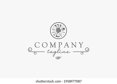 Flower logo inside the circle, looks elegant with a variety of lines and feather