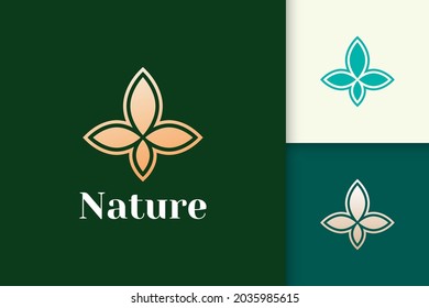 Flower logo in simple and luxury leaf shape for health and beauty
