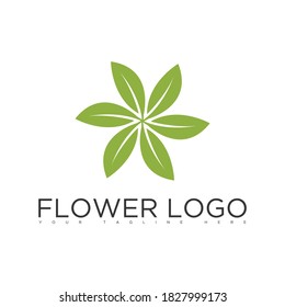 una flor hecha con el logo de tres hojas verdes