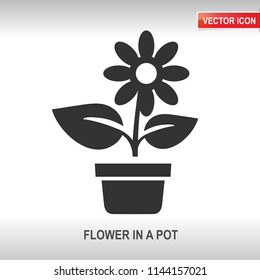 flower in a pot black vector icon on white background
