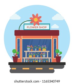 A flower shop on a road showing shop exterior 