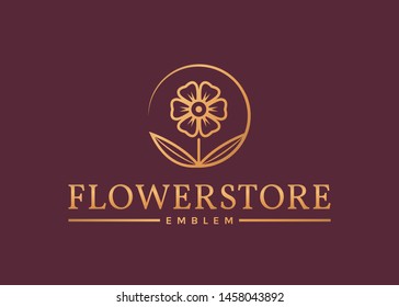 Flower store logo. Elegant golden floral emblem isolated on clean background. Vector template.