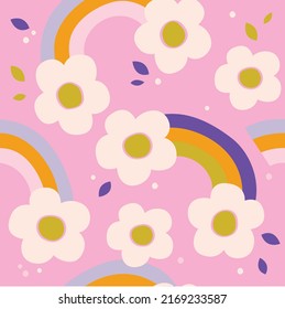 Flower vector seamless pattern with rainbow, dot and leaf in pink background. floral confetti vibrant background. Childish colourful decorative print design