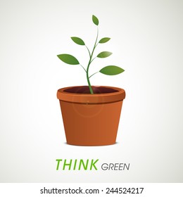 Flowerpot with green plant and Think Green text for Save Plants concept.