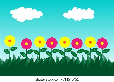 Flowers in the green grass sky background