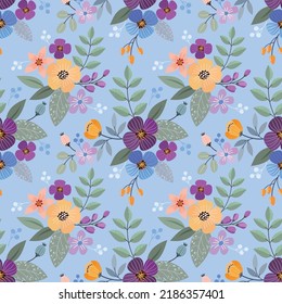Flores y diseño de hojas sobre fondo azul sin fisuras.