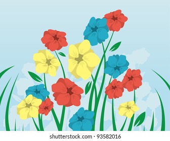 Flowers with long stems coming up from the grass