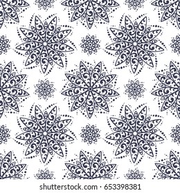 Flowers Mandala Patterns Vector Seamless pattern. Hand Drawn Doodle Round Flower Ornament. Floral Background
