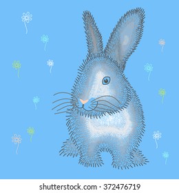 Fluffy grey Easter bunny on glade.