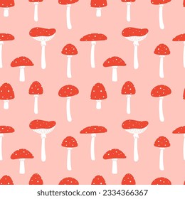 Fly agaric seamless pattern. Hand drawing of mushrooms on a pink background.