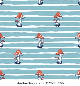 Fly Agaric Seamless Pattern. Vector Blue and White Striped Background with Red Poisonous Mushrooms.