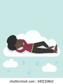 Fly in the clouds and dream, relax and forget about troubles and worries. Black man on huge white cloud