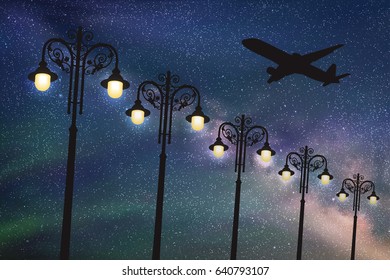 Flying aircraft and vintage lampposts at night. Vector illustration with silhouette of passenger airplane under starry sky