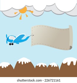 flying airplane with a banner over the mountain