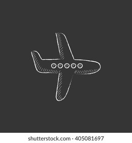 Flying airplane. Drawn in chalk icon.