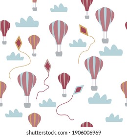 Flying balloons and kites in the sky. The seamless pattern is suitable for children's textiles, cover of notebooks, postcards and any children's design. 