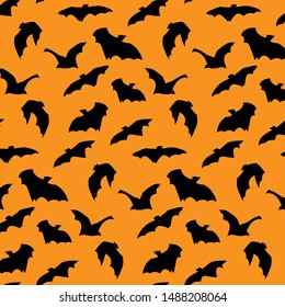  Flying Bat silhouette Halloween seamless pattern on orange background.