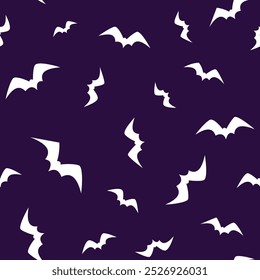 Flying bats seamless pattern on a dark background for Halloween decoration. Design for wallpapers, backdrop and wrapping