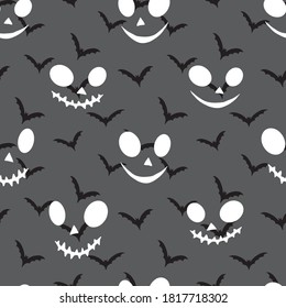 Flying bats. Silhouettes of the wings. Vector seamless pattern.