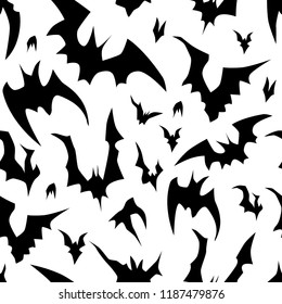 Flying bats vector Halloween seamless pattern in black and white. Design background for party poster. Hand drawn cartoon illustration.