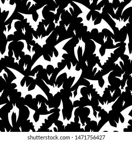 Flying bats vector Halloween seamless pattern in black and white. Design background for party poster. Hand drawn cartoon illustration.