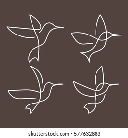 Flying bird continuous line drawing elements set isolated on brown background for logo or decorative element. Vector illustration of animal form in trendy outline style.