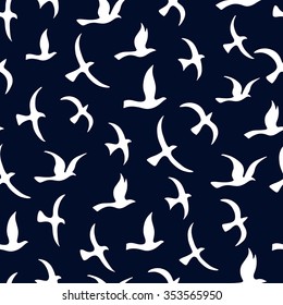 Flying birds seamless pattern.  Silhouette a flock of birds.