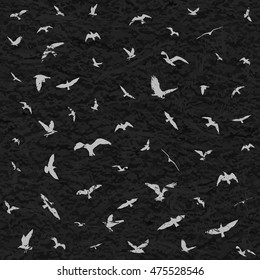 Flying birds silhouettes on black grunge background. Vector illustration