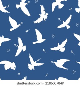 Flying birds silhouettes seamless pattern. Doves of peace silhouettes vector pattern	