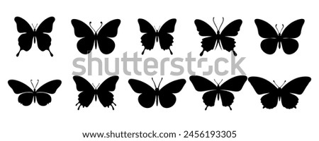 Flying black silhouettes of butterflies. Vector design element