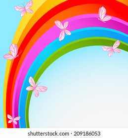 Flying butterflies against the backdrop of the cloudless sky with rainbow