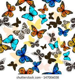 flying butterflies with hearts on wings. seamless background