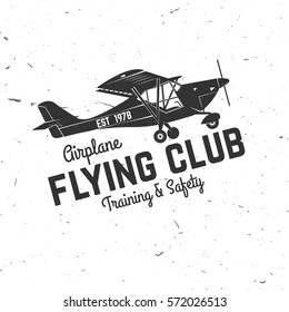 Flying club retro badge. Concept for shirt, print, seal, overlay or stamp. Typography design- stock vector. Flying club design with airplane silhouette.