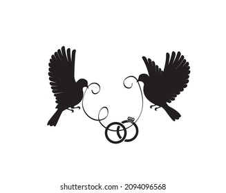 Flying doves silhouettes and carrying a wedding rings isolated on white background, vector. Minimalist art design.