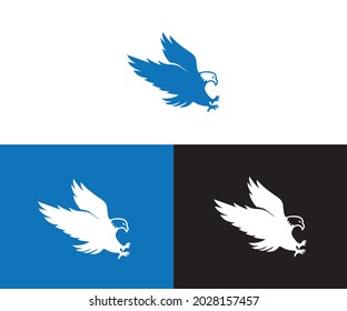 The flying eagle on dark background. Eagle logo template