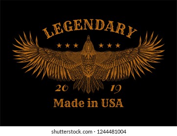 Flying eagle and slogan: " Lendary 2019. Made in USA." Grunge print for t shirt and tattoo art. Boho chic. Orange illustration on the black background.