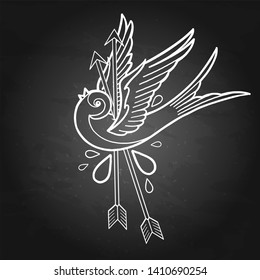 Flying graphic bird pierced by two metal arrows. Vector old school tattoo design isolated on the chalkboard background. Traditional style