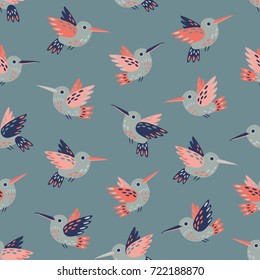 Flying hummingbirds seamless vector pattern in shades of pink and blue.