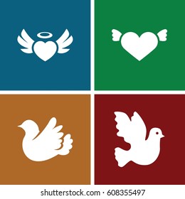 Flying icons set. set of 4 flying filled icons such as heart with wings, heart angel wings